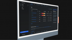 An angled shot of a computer monitor displaying the Docker Hub dashboard in dark mode. The interface shows a list of repository tags with security vulnerability badges, pull counts, and a sidebar for account management.