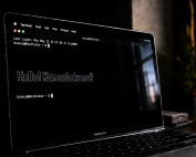 A LLM terminal running on Macbook pro in a dimly lit room at 80 degree image capture