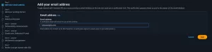 Screenshot of the Amazon SES setup wizard dark mode interface showing "Step 1 Add your email address" selected in the left navigation sidebar. The main panel displays an input field labeled "Email address" with "test.example.com" entered, along with "Cancel" and "Next" action buttons at the bottom right.